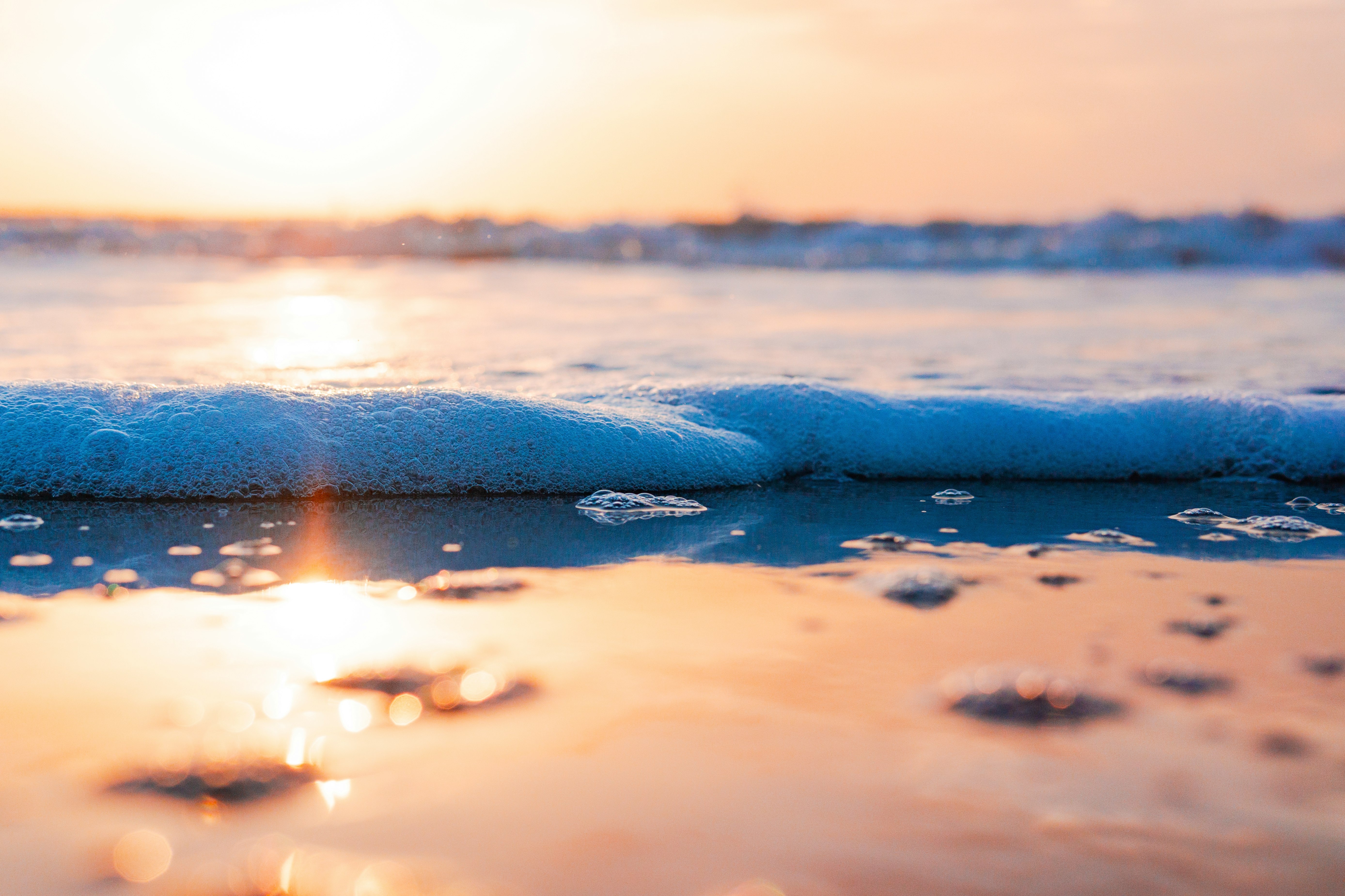 close up photo of sea waves during sunset